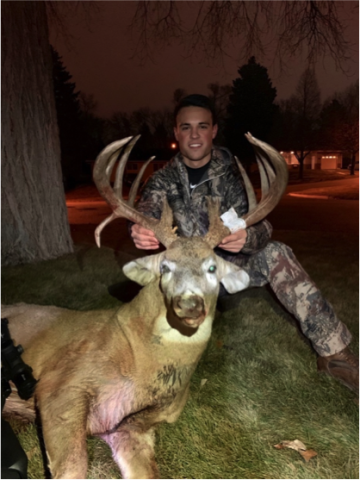 Hunter with a trophy deer