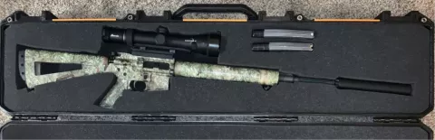 AR15 in case with Burris Eliminator riflescope mounted on it