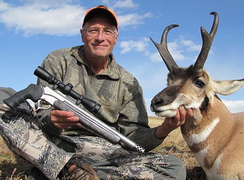 Hunter with handgun and Burris scope with antelope