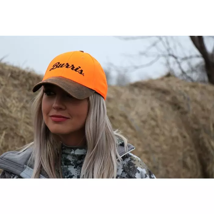 Female wearing blaze orange hunting hat